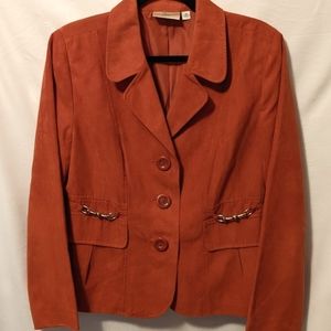 Beautiful faux suede lined jacket with buckle accents.